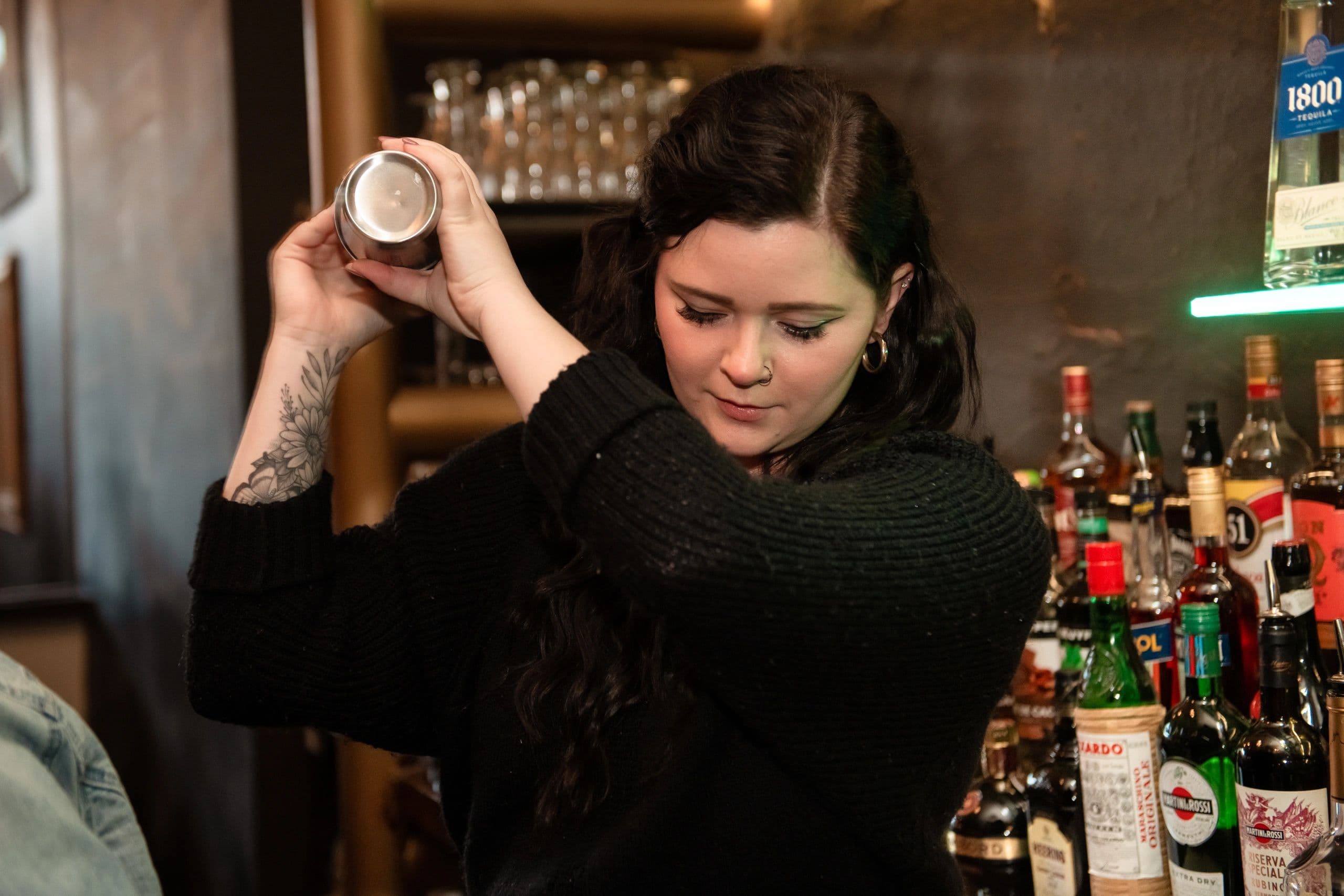 Bartender preparing a cocktail at Palace Rooms